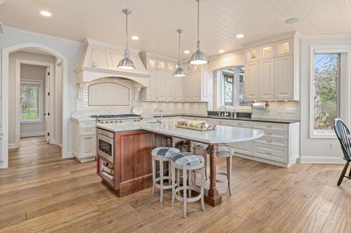 Spectacular, fully updated kitchen featuring custom cabinetry, premium countertops, Wolfe, LaCanche, and SubZero appliances, and hand-scraped French oak floors—luxury and function in perfect harmony.