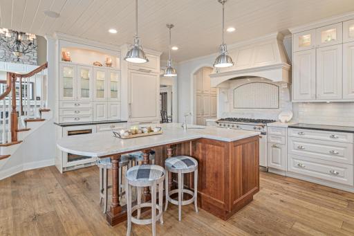 Large center island with seating for breakfast, reading the paper or enjoying your morning coffee. Invite family and friends to help prepare the meal around this gathering spot.