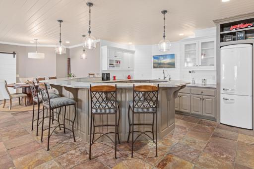 Invite the team over for a carbo load, host Fourth of July or just watch the big game in this incredible space.
