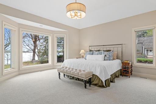 Main floor owner's suite with breathtaking lake views, custom built-ins, and freshly updated with new carpet and paint—your private retreat awaits.