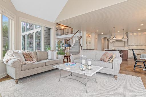 Open and airy view from the hearth room toward the kitchen, dinette, and living room—an incredible floor plan designed for seamless entertaining and effortless flow.