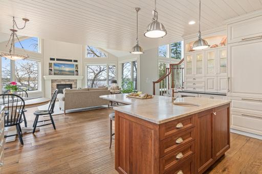 Updated kitchen with hand-scraped French oak floors, fresh paint, modern light fixtures, and breathtaking views of Turtle Lake. Large center island perfect for buffet style entertaining and casual conversation.