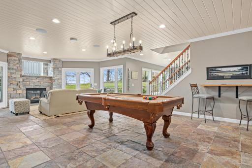 Billiards area with heated floors throughout the lower level—game night just got a whole lot more fun and comfortable.