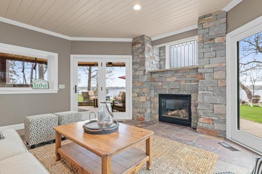 Cozy up to the fireplace in the lower-level hearth room on cold winter nights. Double patio doors provide easy access to the outdoors.