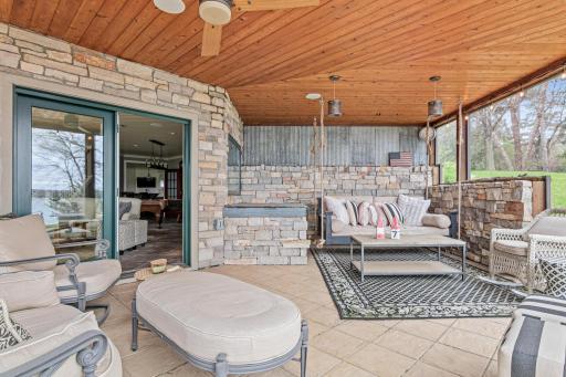 Incredible screened porch with breathtaking lake views—perfect for a nap, reading a book, or enjoying a chat with a friend. This will be your summer destination spot.