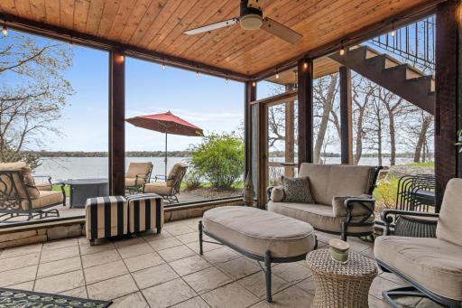 Another stunning view of the screened porch, where you can unwind and enjoy the serene beauty of the lake—your private sanctuary for relaxation and tranquility.