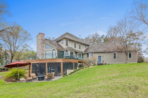 Extensive landscaping, a cozy firepit area, and more enhance the estate-like quality of this home and property, located on the cleanest lake in Ramsey County for the ultimate in lakeside living.