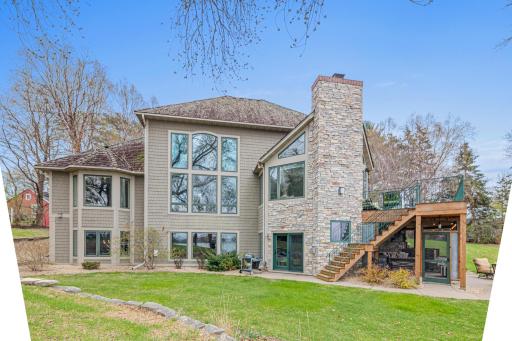 Additional flat yard space perfect for kicking a ball, throwing a pitch, or playing a game of bags—enjoy beautiful green space throughout this expansive property.