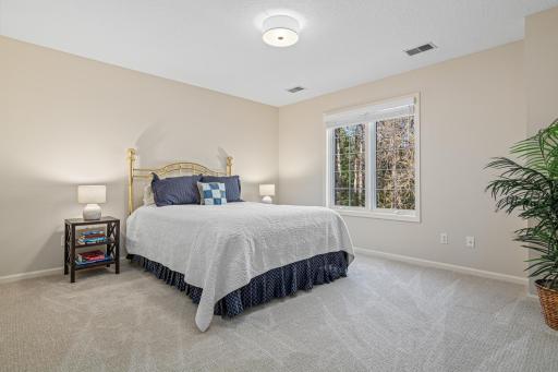 One of three spacious bedrooms upstairs with all new carpet, paint and light fixture.