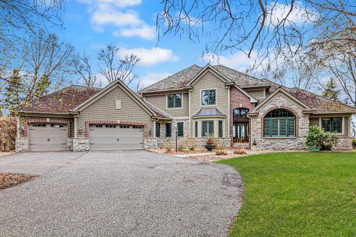 Welcome to lakeside luxury on prestigious Turtle Lake—this exceptional 6,000+ sq ft estate sits on 3.6 private acres with 177 feet of pristine sandy shoreline, offering unmatched serenity and elegance.