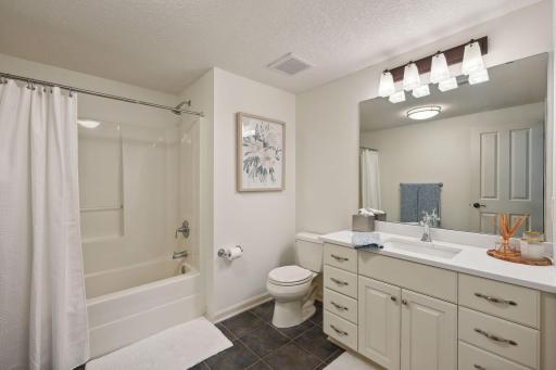 Lower level full bathroom is conveniently located for easy access to the pool and outdoor entertaining space.