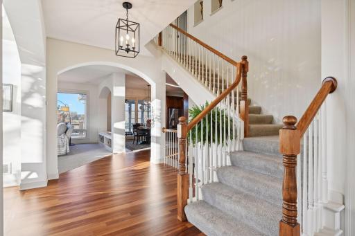 Staircase leads to upper level featuring four large bedrooms.