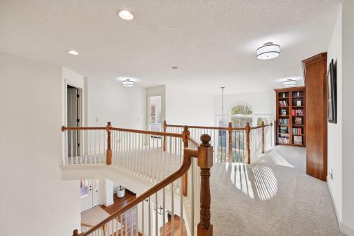 Open staircase is flooded in natural light.