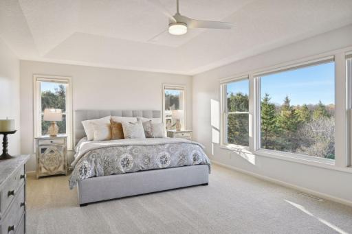 Tray ceiling enhances the expansiveness of the main bedroom.