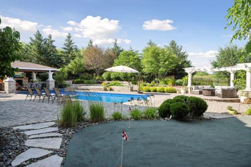 Putting green overlooking your pool and patio.