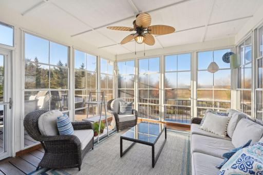 Screened porch with window system that expands the season. Flooring is maintenance free.