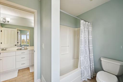 J&J bathroom has private shower and toilet room.