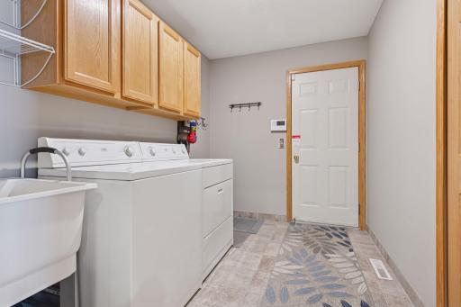 True main level living with this helpful mudroom/laundry room.