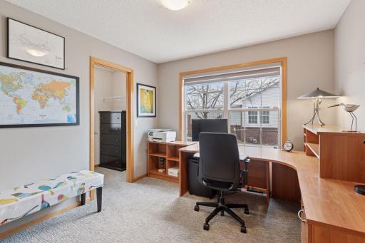 Main floor bedroom with walk-in closet is a great guest bedroom or wonderful office/hobby room