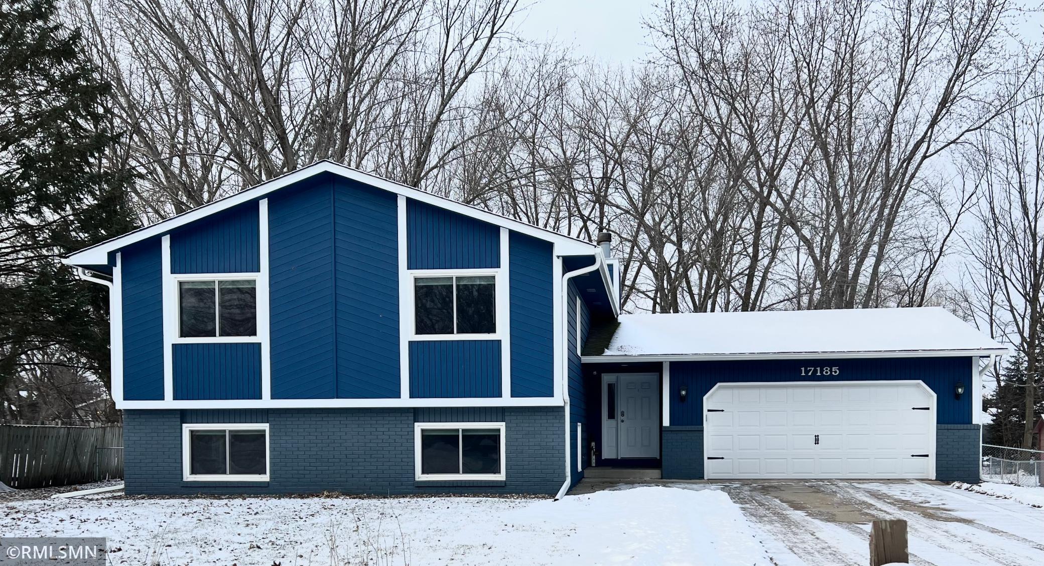 Front of the Home showing new paint, roof and garage door!