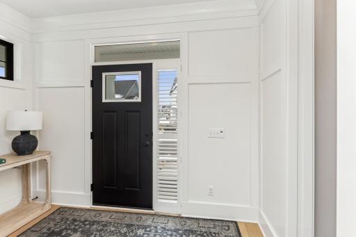The open and airy layout of the foyer makes it feel spacious and welcoming, providing a smooth transition into the main living areas.