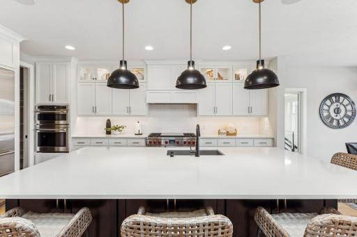 Experience the perfect blend of luxury and practicality in this kitchen, with state-of-the-art appliances, a grand island as the centerpiece and a walk-in pantry