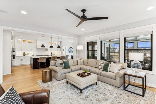 Enjoy the harmony of indoor and outdoor living with the great room flowing into the kitchen and dining room, and a view that extends to the covered rear porch, creating a perfect setting for relaxation and entertainment.