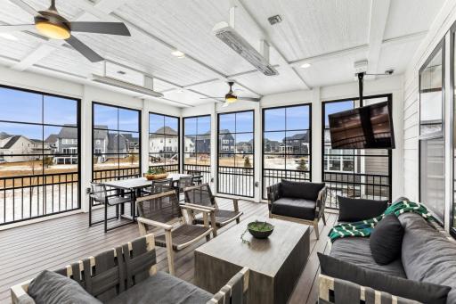 This enclosed patio offers a versatile and inviting space that is perfect for entertaining. The room features expansive windows with easy-to-use screens, two remote heaters, built in speakers and maintenance free decking.
