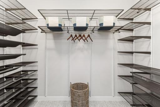 This spacious shoe and coat closet in the mudroom ensures convenient storage for all 4 seasons, making it easy to grab what you need on your way out and keep everything tidy when you return.