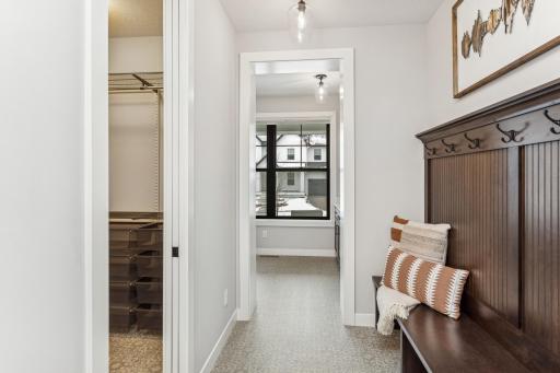 The boot bench adds a touch of comfort and convenience to the mudroom, offering a dedicated place to manage shoes and outerwear, making daily routines smoother.