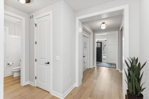 This centrally located 1/4 bath combines practicality with elegance, providing a discreet and accessible space for quick refreshes, enhancing the overall functionality of the home.
