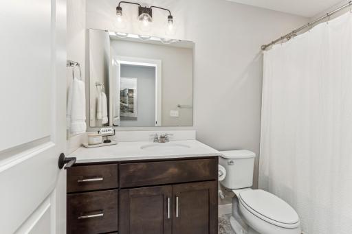 The private ensuite in this bedroom is a perfect blend of comfort and sophistication, ensuring a tranquil and private retreat for its occupants.