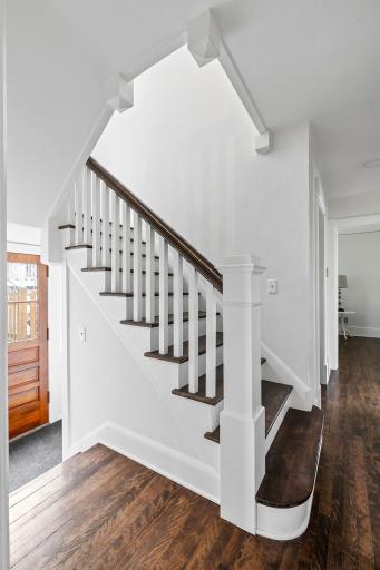 Main level staircase and access to side yard and lower level
