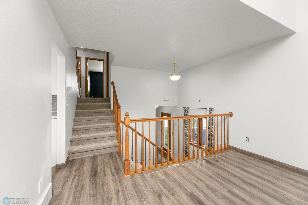 Living Room looking to Foyer & Upper Level