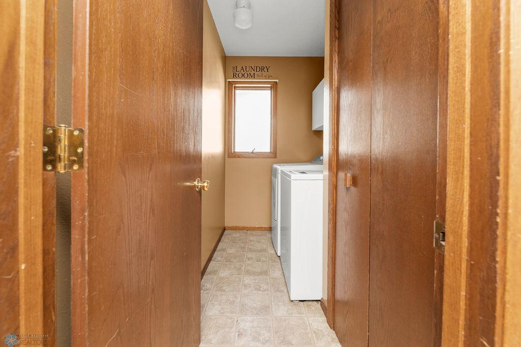 Laundry Room w/ Storage Closet & Window