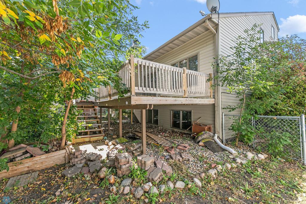 Beautifully shaded & private back deck with stairs to yard