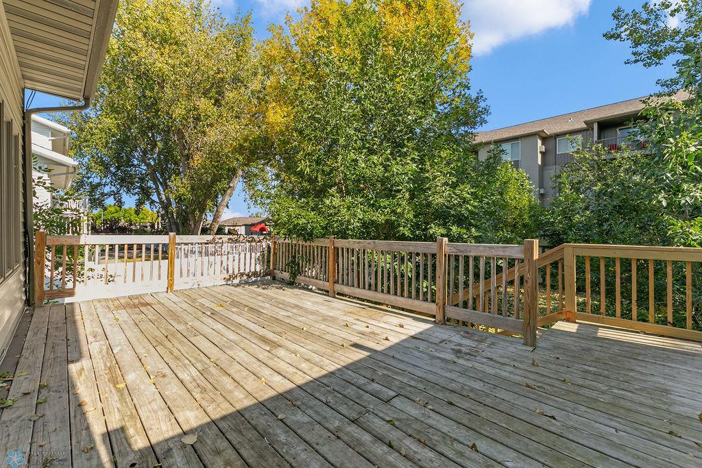 Huge Wood Deck w/ stairs leading to Backyard