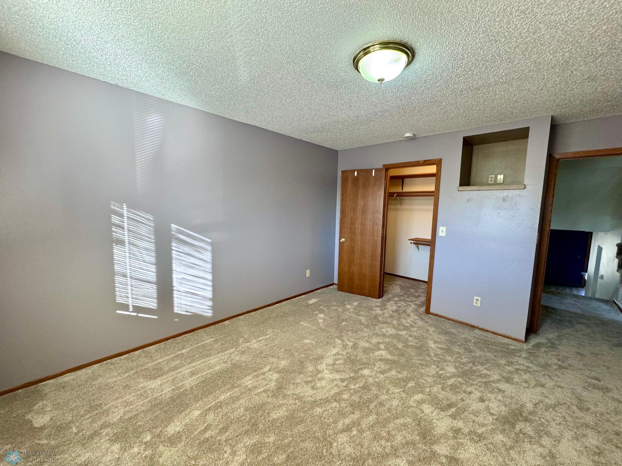 Bedroom 2 w/ walk-in closet & storage nook