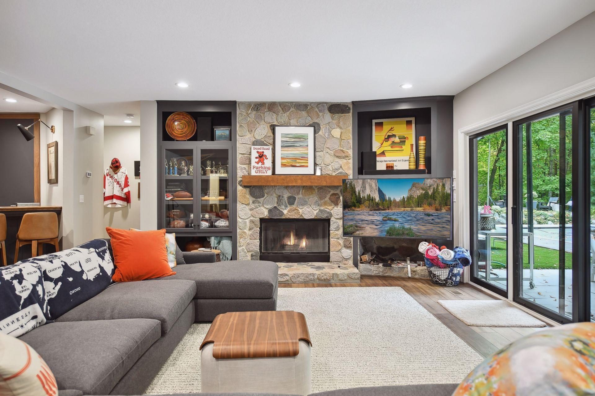 Patio doors from lower level to stone patio and pool.