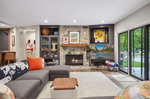 Patio doors from lower level to stone patio and pool.