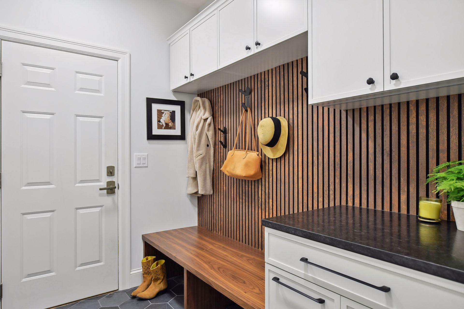Mudroom with drop station, bench/hooks plus closet/shoe cabinets