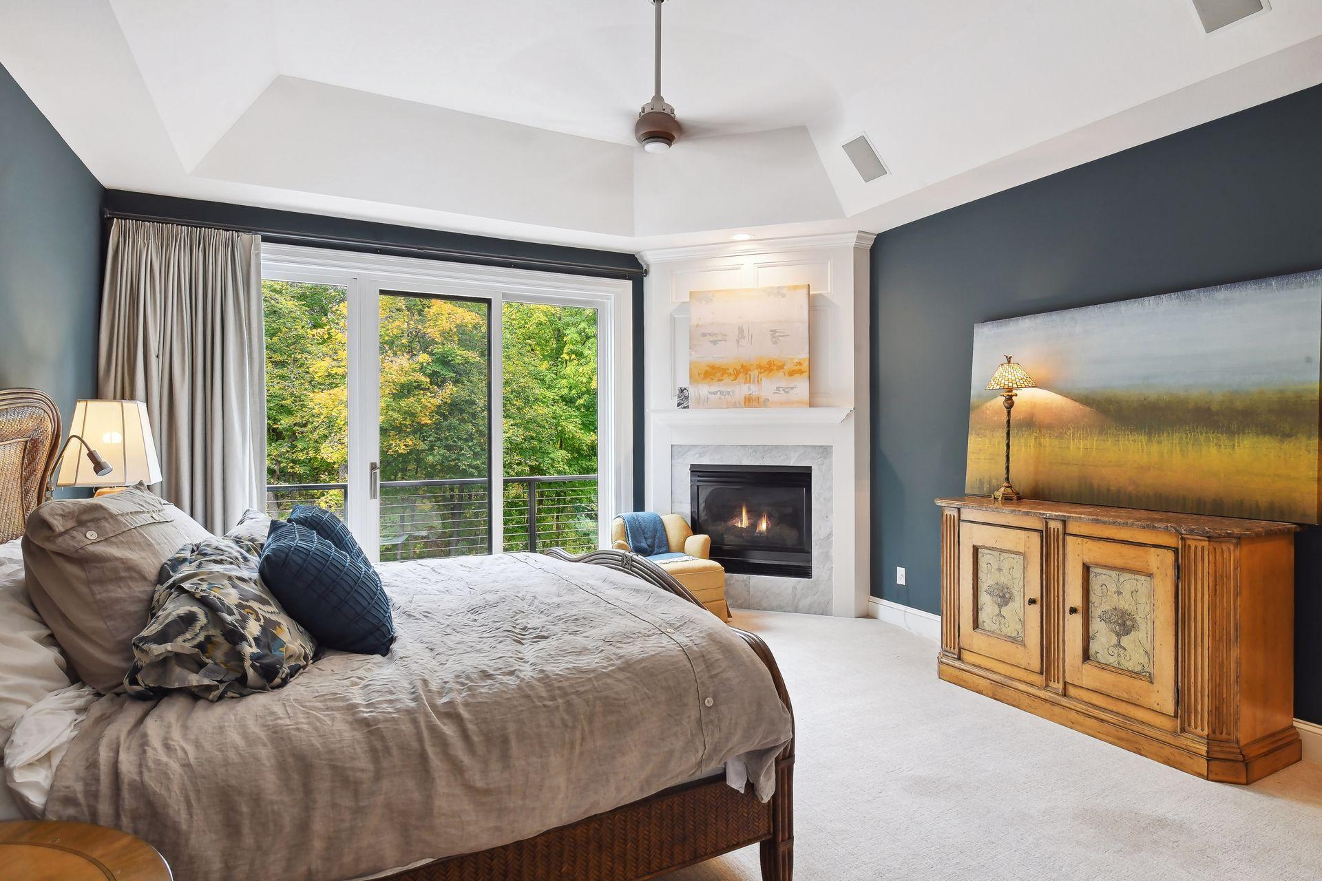 Primary suite with fireplace and outdoor patio access.