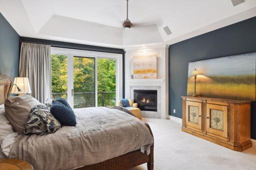 Primary suite with fireplace and outdoor patio access.