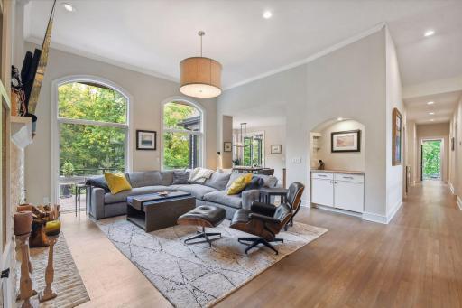 Great room with high ceilings, tons of windows, wine niche with subzero beverage fridge