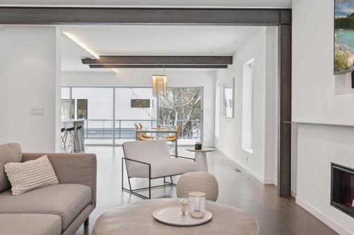 Living room opens into the dining room and kitchen