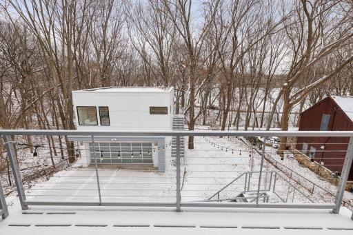Deck overlooks the woods surrounding most of the property