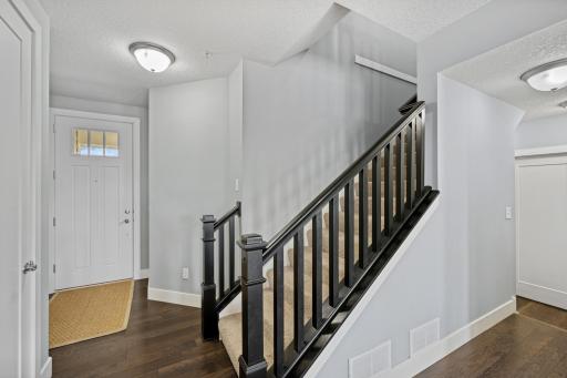 A beautiful stairway leading to the upper level.