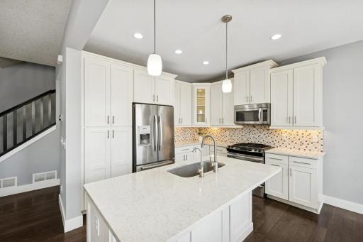 Cabinet and storage space is abundant in this elegant kitchen.