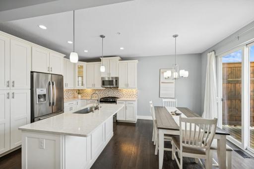 Huge counter island and stainless-steel appliances.