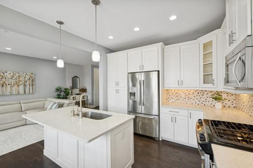 Gleaming stainless steel appliances add to the beauty of this kitchen.
